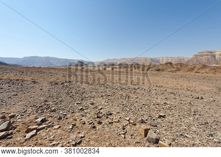 Melancholy And Emptiness Of The Rocky Hills Of The Negev Desert In Israel. Breathtaking Landscape An