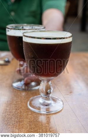 Glasses With Cold Dark Strong Belgian Abbey Beer Served Outdoor
