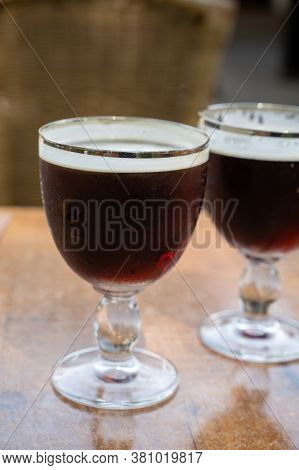 Glasses With Cold Dark Strong Belgian Abbey Beer Served Outdoor