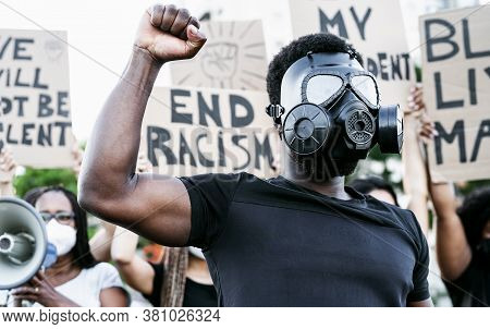 Activist Wearing Gas Mask Protesting Against Racism And Fighting For Equality - Black Lives Matter D