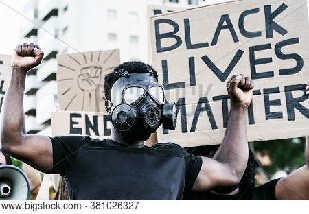 Activist Wearing Gas Mask Protesting Against Racism And Fighting For Equality - Black Lives Matter D