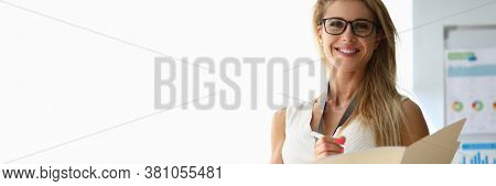 Portrait Of Lovely Businesswoman Posing With Document. Female Wearing Presentable White Dress For Co