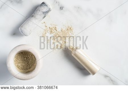Ubtan Natural Face Wash Cosmetic Preparation. Bowl With Ubtan Powder And Beauty Product Bottle On Ma