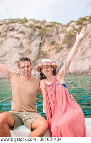 Coupl On Honeymoon Sailing On Boat In Clear Open Sea