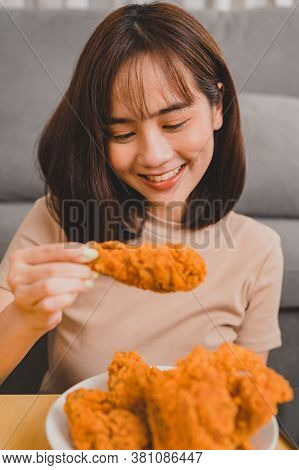 Eating Fried Chicken When Takeout And Delivery. Fast Food Takeaway Back Home.  Asian Woman Lifestyle