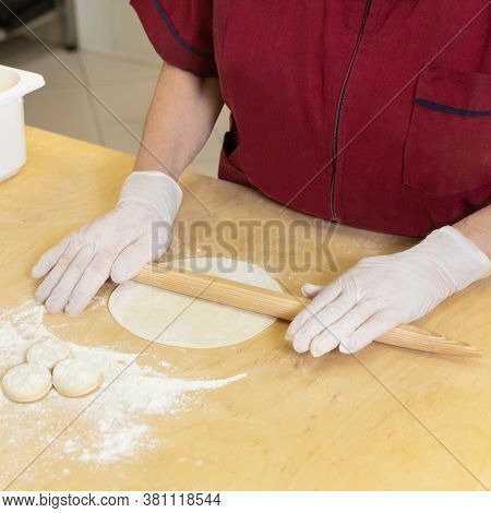 Woman Making Qutab Meal From Dough Close Up