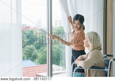 Happy Family With Mix Skin.  Granddaughter Take Care Of Her Grandmother At Home. Combination Concept