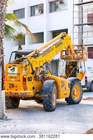 Paphos, Cyprus - November 23, 2013 Construction Works. Jcb Telescopic Handler Working Near New Build