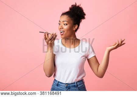 Voice Search. Emotional Black Girl Using Smart Phone Voice And Talking, Holding Gadget Near Mouth
