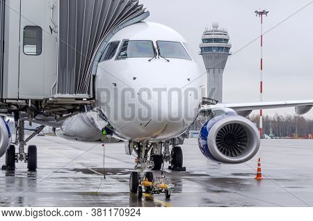 View Of The Nose And Cockpit Of The Aircraft Directly Standing On The Airport Apron. Control Atc Tow