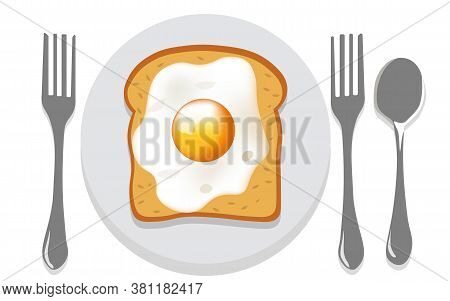 Breakfast Composition Of Toasted Bread With Fried Egg On A Plate With Two Forks And A Spoon Nearby