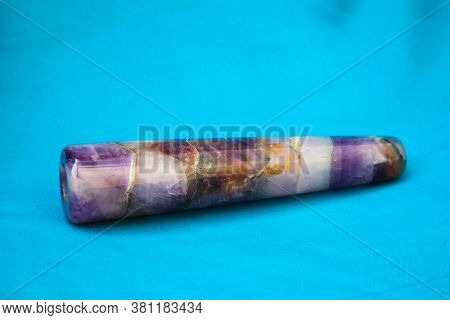 Clay Chillum For Marijuana Smoking On A Blue Fabric Background