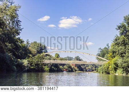 The River Flows Through The Resort Town Of Goryachy Klyuch. Bridge Over A Mountain River.