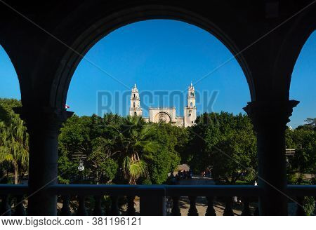 View Through Arches To The Cathedral Of Merida Over The Main Square Park Plaza Grande From The Olimp