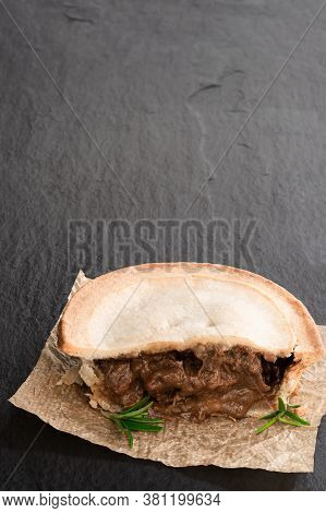 Pukka  Pie Pasty On Black Stone Background