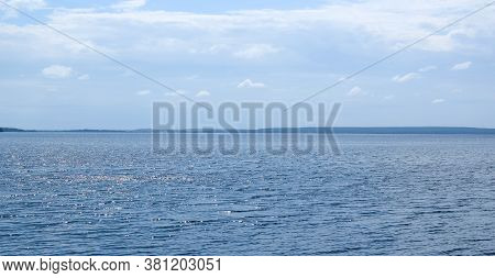 Lake Uvildy, Southern Urals (chelyabinsk Region, Russia). Lake View In Summer. Sun Glare On The Wate