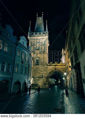 Czech Republic, Prague 11 March 2020: Prague, Smalltown Bridge Tower In The Night After Rain