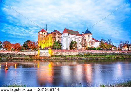 Picturesque Morning View Of Hartenfels Castle On Banks Of The Elbe. Dramatic Sunrise. Location: Torg