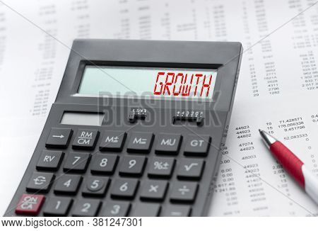A Calculator With The Inscription Growth . Business Profit Concept