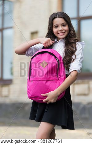 Back To School Essentials I Need. Happy Child Hold Schoolbag Outdoors. Little Child Wear Uniform. Ba