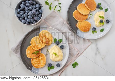 Pancakes With Blueberries And Vanilla Sauce For Breakfast