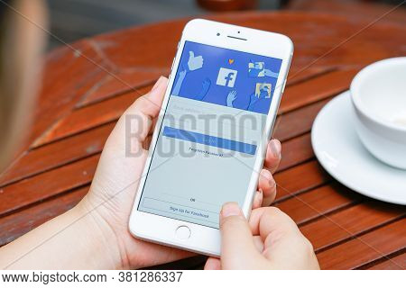 Chiang Mai, Thailand - Aug 1,2020: Woman Holds  Apple Iphone 8plus With Facebook Application On The 