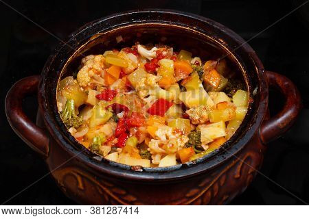 Close-up Of A Vegetable Stew In A Pot. Finely Chopped Various Vegetables Stewed In A Saucepan. Healt