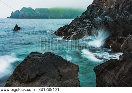 Rocky Sea Shore, Cliffs With Surf On The Gamova Peninsula In The Primorsky Territory, Seascape Of Ru