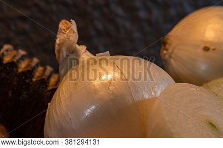 Tubers Of Onions (allium Cepa) Cut In Halves On Wooden Board