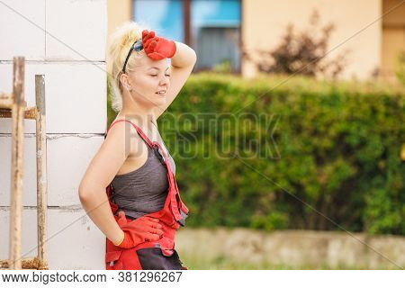 Heavy Working Woman On Construction Site