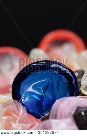 High-quality Blue Latex Condom, A Means To Prevent Pregnancy And Infection, Close-up And Small Depth