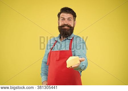 Quality Cheese Production. Happy Bearded Man Give Taste Cheese. Cheesemaking Concept. Cheese Maker O