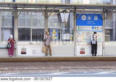 August 5, 2020, Hiroshima, Japan - People Wait For A Hiroshima Streetcar (hiroden) At Hondori Statio