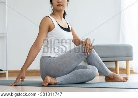 Women Are Doing Seated Twist Exercises For Health And A Firmer Body. Yoga Concept