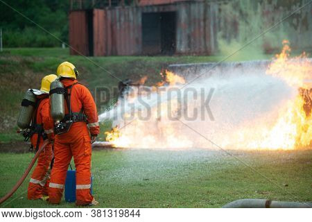 Firefighters Spraying Water To Put Out A Brutal Fire On The Truck.
