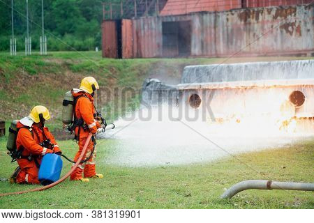 Firefighters Spraying Water To Put Out A Brutal Fire On The Truck.
