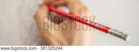 Vietnam, Nha Trang, 14.07.2020: Ielts Red Pencils And Essay Notebook For The English Exam Banner, Lo