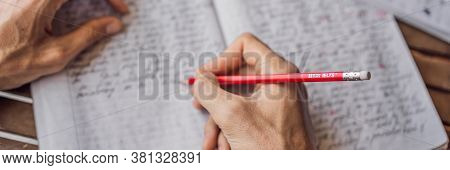 Vietnam, Nha Trang, 14.07.2020: Ielts Red Pencils And Essay Notebook For The English Exam Banner, Lo