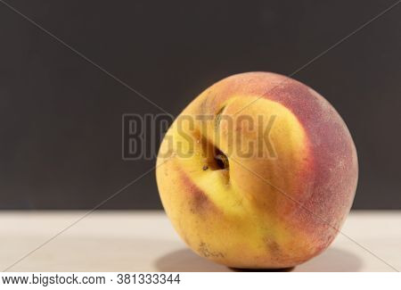 Peach Fruits (prunus Persica) In Natura On A Woody Background