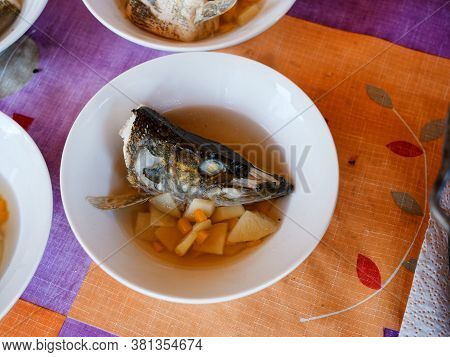 Fish Soup In A Plate With A Potato, And Other Components.