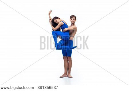 Winter. Couple Of Modern Dancers, Art Contemp Dance, Blue And White Combination Of Emotions. Flexibi