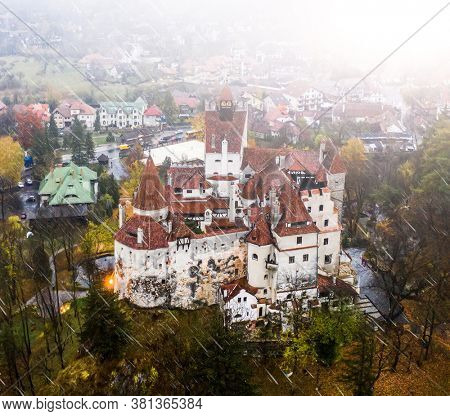 Overview of historical Bran Fortress in Romania in the rain