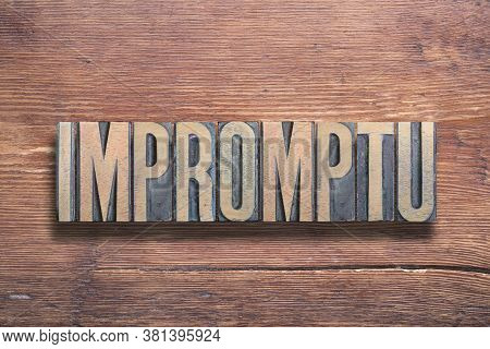 Impromptu Word Ancient Latin Word Meaning - Spontaneous, Combined On Vintage Varnished Wooden Surfac