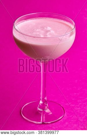 Pina Colada - Tropical Cocktail With Kahlua, Coconut Milk And Rum. Fresh Summer Drink On Purple Back