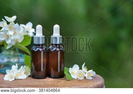 Essential Jasmine Oil. Bioproduct, Organic Cosmetics. Perfumery, Cosmetology, Aromatherapy
