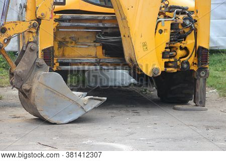 Small Tracked Excavator To Dig A Hole To Fix A Water Leak At A Large Commercial Housing Developmen