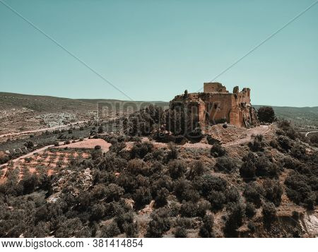 Aerial High Up Photography Drone Point Of View Of Ruins Of The Castle Of Montesa Located On Hillside