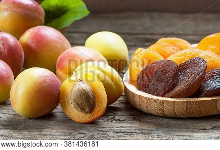 Natural Dried Apricots With Fresh Whole Ripe Apricot And Half In Bamboo Bowl On Rustic Table, Dry Ap