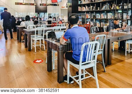 Bangkok-thailand, July 14, 2020: Unidentified Customers Work On Computer With Smartphone And Relax W