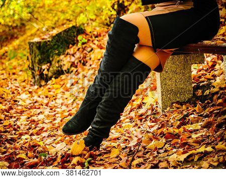 Woman Wearing Black Knee High Boots